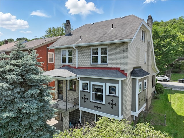 1150 Morningside Ave, Morningside, PA 15206 - rear view of house featuring a chimney, brick siding, roof with shingles, and a porch