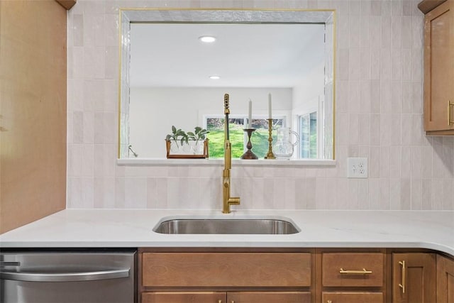 507 Edgehill Dr, Richland, PA 15044 - kitchen featuring stainless steel dishwasher, brown cabinetry, light countertops, a sink, and backsplash