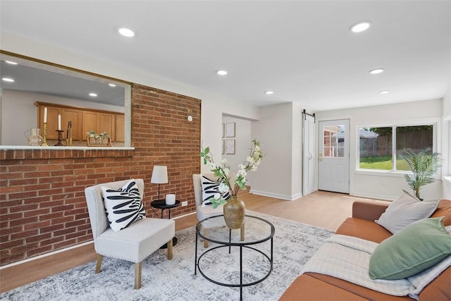 507 Edgehill Dr, Richland, PA 15044 - living room featuring light wood finished floors, recessed lighting, brick wall, and a barn door