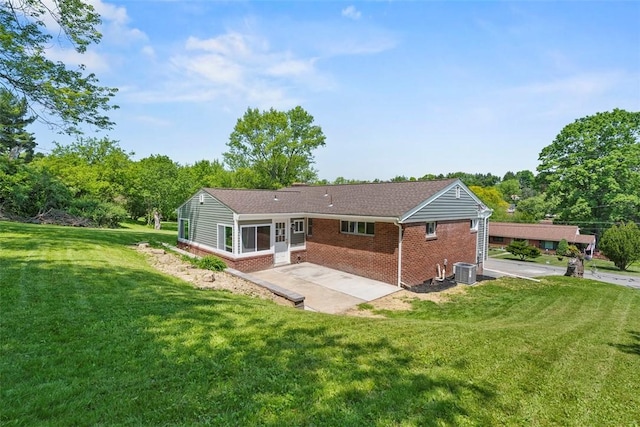 507 Edgehill Dr, Richland, PA 15044 - back of house featuring brick siding, central air condition unit, a patio area, and a lawn