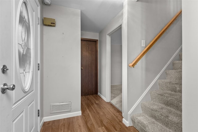765 Brookshire Dr, Mccandless, PA 15237 - foyer entrance featuring wood finished floors, baseboards, and stairway