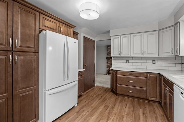 765 Brookshire Dr, Mccandless, PA 15237 - kitchen featuring white appliances, light wood-style floors, light countertops, and decorative backsplash