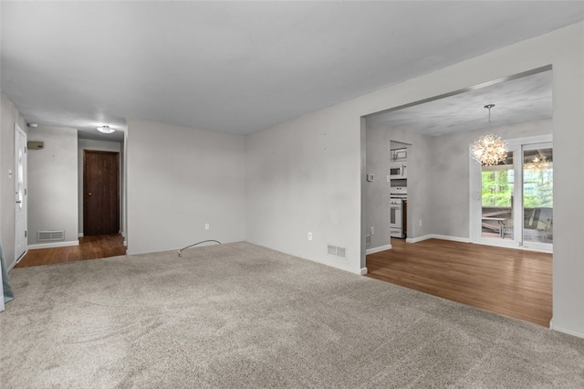 765 Brookshire Dr, Mccandless, PA 15237 - spare room featuring carpet flooring, a chandelier, and baseboards