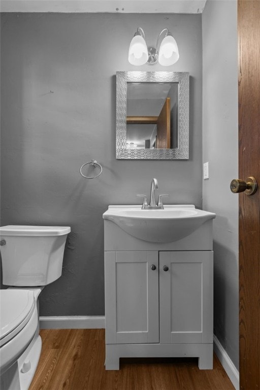 765 Brookshire Dr, Mccandless, PA 15237 - bathroom featuring wood finished floors, toilet, vanity, and baseboards