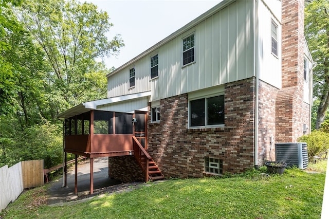 765 Brookshire Dr, Mccandless, PA 15237 - rear view of house featuring a sunroom, cooling unit, stairs, a chimney, and board and batten siding