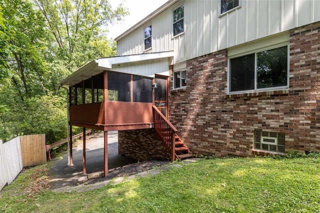 765 Brookshire Dr, Mccandless, PA 15237 - back of house featuring a sunroom, board and batten siding, brick siding, and stairs