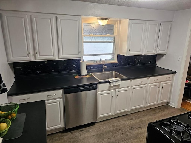 1099 Vine St, Coraopolis, PA 15108 - kitchen featuring dishwasher, a sink, dark countertops, and white cabinets