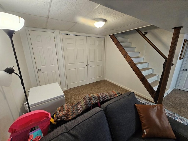 1099 Vine St, Coraopolis, PA 15108 - carpeted living area with a paneled ceiling, stairway, and baseboards