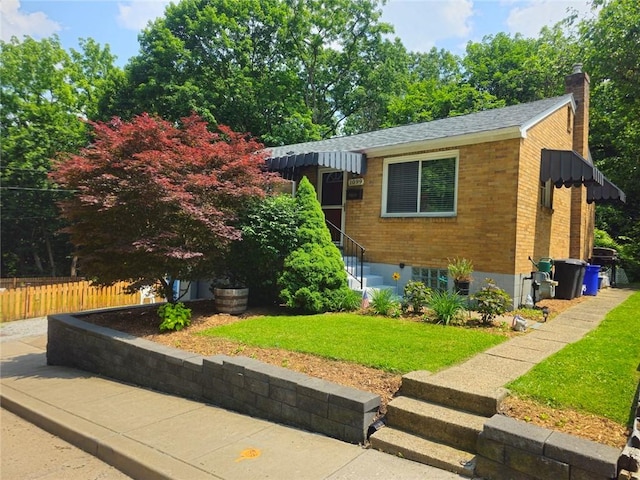 1099 Vine St, Coraopolis, PA 15108 - view of front facade featuring brick siding and a chimney