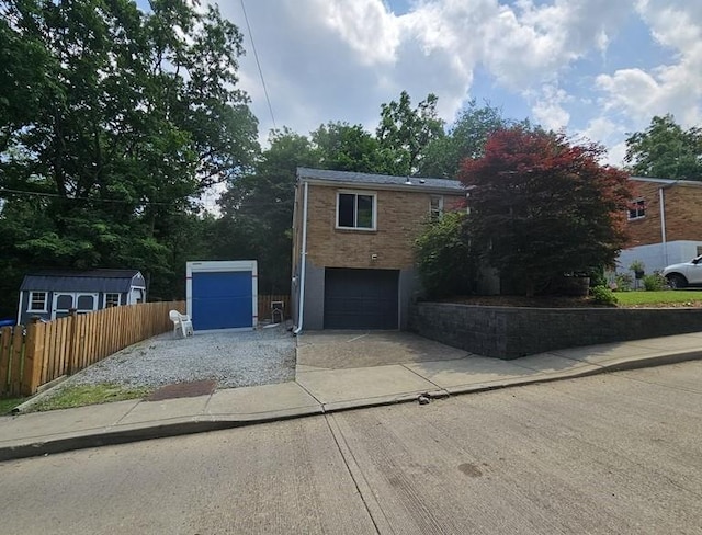1099 Vine St, Coraopolis, PA 15108 - view of front of property featuring driveway, an attached garage, and brick siding