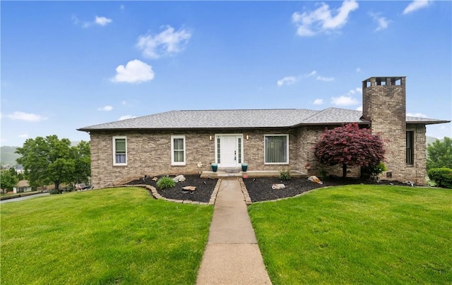 155 Pride Dr, Rostraver, PA 15012 - view of front facade featuring a chimney, a front yard, and roof with shingles