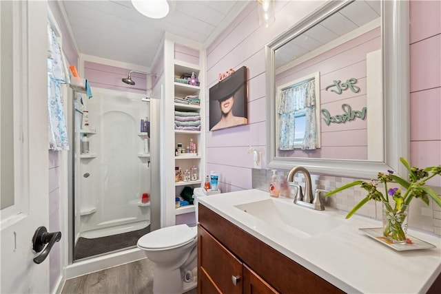 155 Pride Dr, Rostraver, PA 15012 - bathroom featuring a shower stall, vanity, wood finished floors, and tasteful backsplash