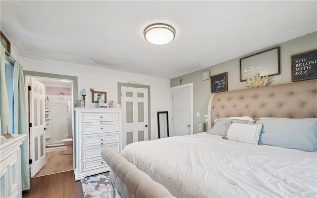 155 Pride Dr, Rostraver, PA 15012 - bedroom with dark wood-type flooring and connected bathroom