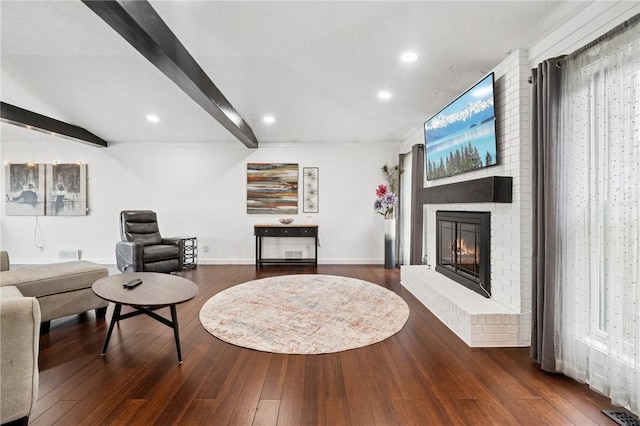 155 Pride Dr, Rostraver, PA 15012 - living area featuring beamed ceiling, wood finished floors, a brick fireplace, and recessed lighting