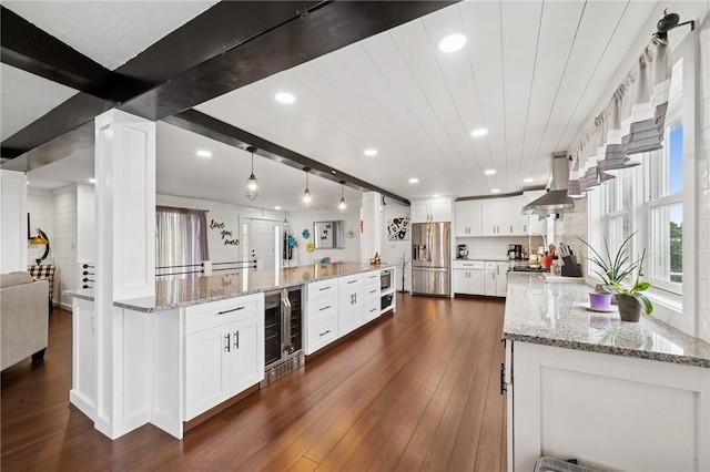155 Pride Dr, Rostraver, PA 15012 - kitchen with stainless steel appliances, island range hood, beverage cooler, recessed lighting, and white cabinets