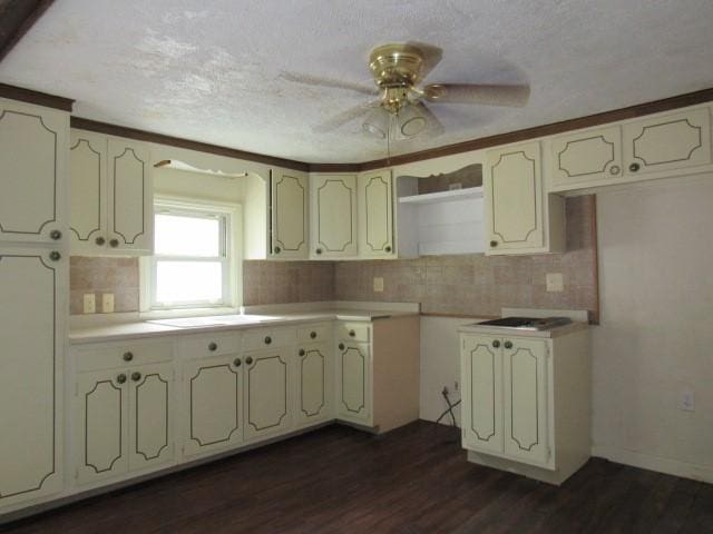 313 Dalton Run Rd, Conemaugh Twp Som, PA 15905 - kitchen with a ceiling fan, dark wood-type flooring, tasteful backsplash, a textured ceiling, and light countertops