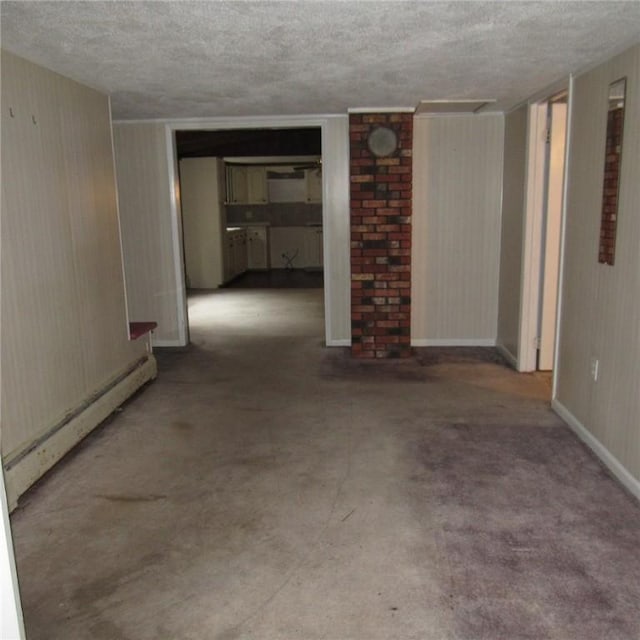 313 Dalton Run Rd, Conemaugh Twp Som, PA 15905 - unfurnished living room with a baseboard radiator, a textured ceiling, and carpet