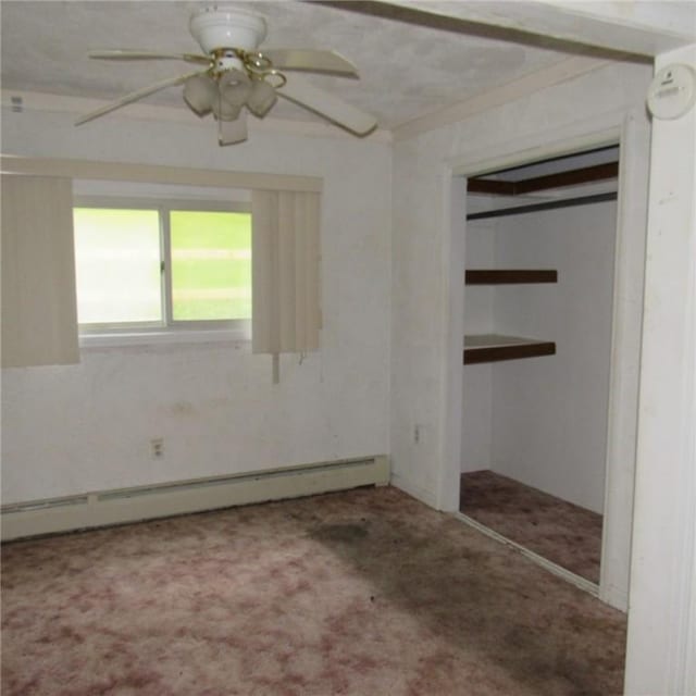 313 Dalton Run Rd, Conemaugh Twp Som, PA 15905 - unfurnished bedroom featuring a baseboard heating unit, carpet flooring, a closet, and a ceiling fan
