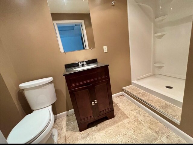 4184 Battle Ridge Rd, South Fayette, PA 15057 - bathroom featuring toilet, vanity, a shower, and baseboards