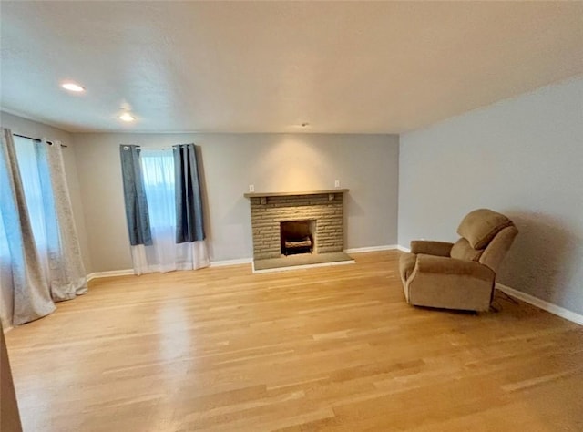 4184 Battle Ridge Rd, South Fayette, PA 15057 - unfurnished living room featuring baseboards, light wood finished floors, a fireplace, and recessed lighting