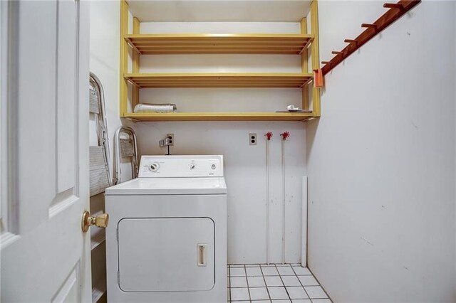 952 Seybertown Rd, Perry Twp, PA 16041 - laundry area with washer / dryer and light tile patterned flooring