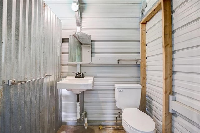 952 Seybertown Rd, Perry Twp, PA 16041 - half bathroom featuring toilet and concrete flooring