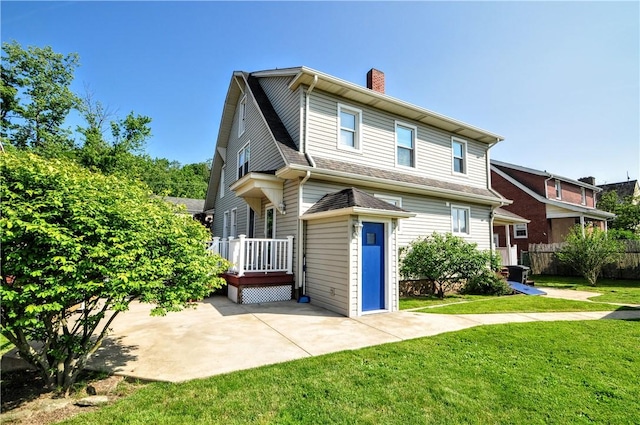 232 Center Ave, Elizabeth Twp/Boro, PA 15037 - back of property featuring a chimney and a patio area