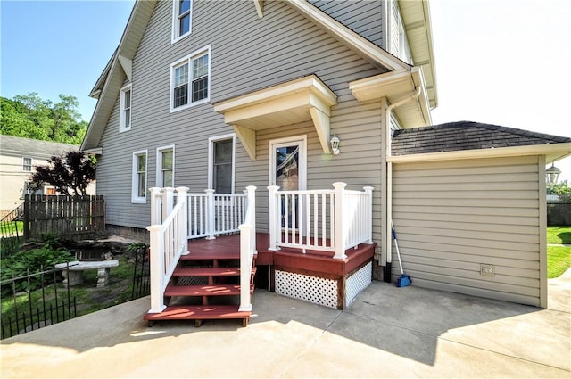 232 Center Ave, Elizabeth Twp/Boro, PA 15037 - view of front of home featuring a wooden deck, a garage, a patio area, and concrete driveway