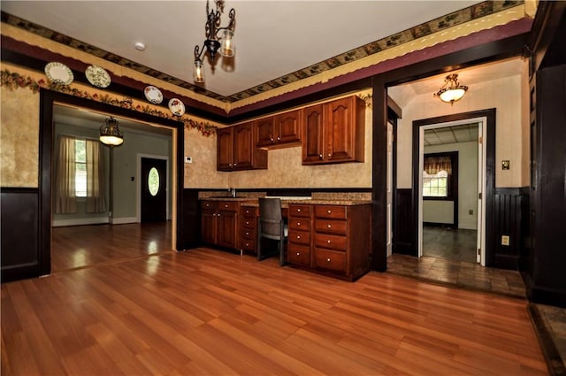 232 Center Ave, Elizabeth Twp/Boro, PA 15037 - kitchen featuring wainscoting, dark wood finished floors, a sink, healthy amount of natural light, and decorative light fixtures