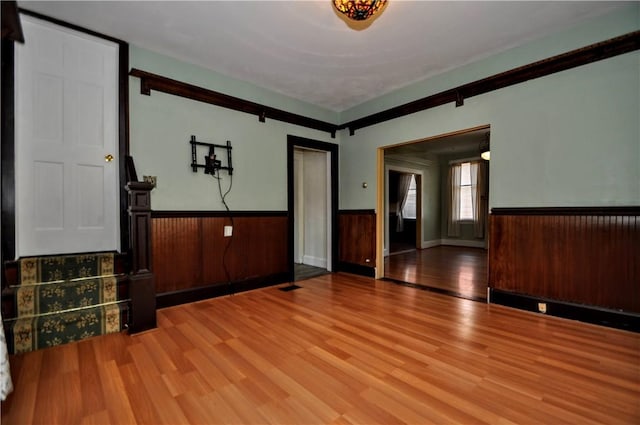 232 Center Ave, Elizabeth Twp/Boro, PA 15037 - unfurnished living room with wainscoting and wood finished floors