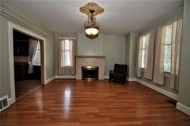 232 Center Ave, Elizabeth Twp/Boro, PA 15037 - unfurnished living room with healthy amount of natural light, baseboards, wood finished floors, and a fireplace
