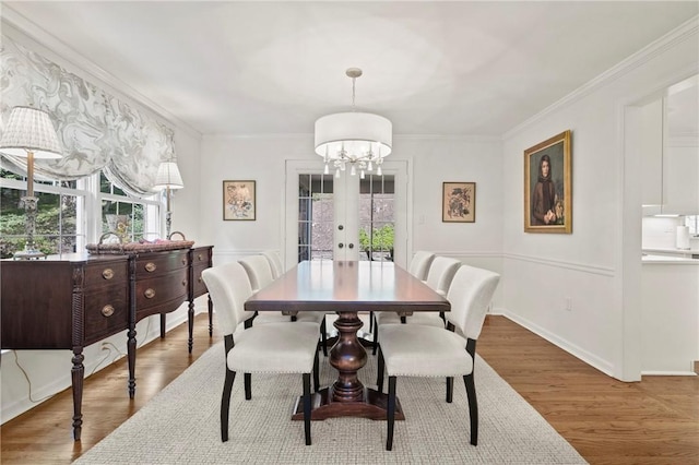 306 Wildberry Rd, Fox Chapel, PA 15238 - dining room featuring a chandelier, wood finished floors, french doors, and crown molding