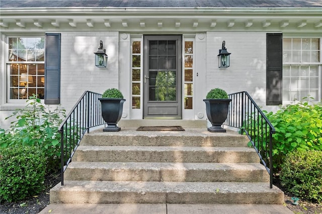 306 Wildberry Rd, Fox Chapel, PA 15238 - view of exterior entry with brick siding, a shingled roof, and a porch