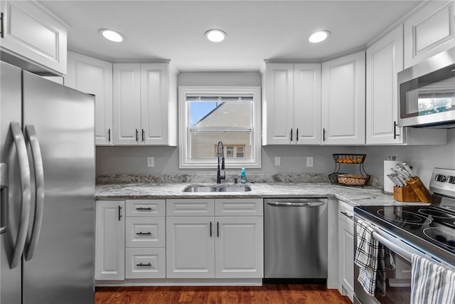 1368 Berryman Ave, South Park, PA 15129 - kitchen with appliances with stainless steel finishes, a sink, white cabinets, dark wood-style floors, and recessed lighting