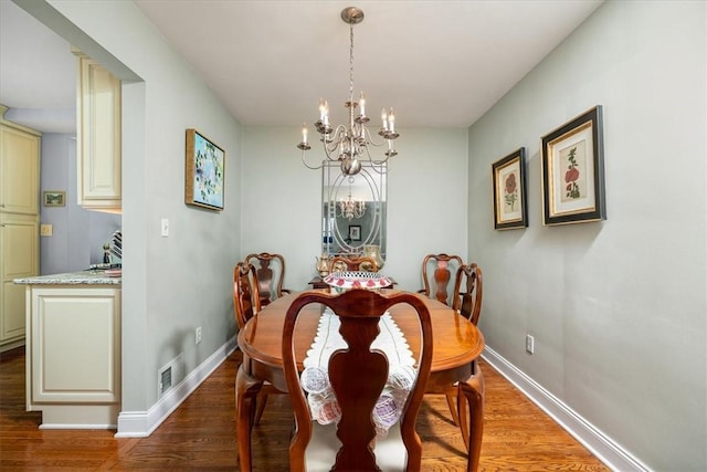 109 Parkview Rd, Ross Twp, PA 15237 - dining space with a chandelier, wood finished floors, and baseboards