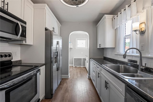 159 Jefferson Ave, Vandergrift Wml, PA 15690 - kitchen featuring appliances with stainless steel finishes, a sink, dark countertops, and healthy amount of natural light