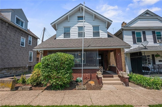 159 Jefferson Ave, Vandergrift Wml, PA 15690 - view of front of house featuring covered porch, brick siding, and roof with shingles
