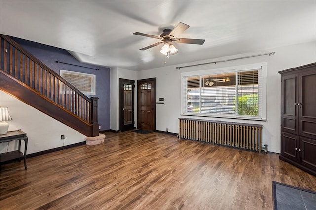 159 Jefferson Ave, Vandergrift Wml, PA 15690 - entrance foyer featuring radiator heating unit, stairs, wood finished floors, a ceiling fan, and baseboards