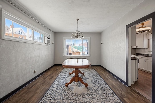 159 Jefferson Ave, Vandergrift Wml, PA 15690 - dining room with a chandelier, dark wood-type flooring, and baseboards