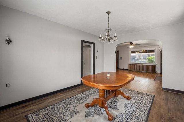 159 Jefferson Ave, Vandergrift Wml, PA 15690 - dining area with radiator, arched walkways, wood-type flooring, ceiling fan, and baseboards