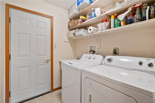3028 Wachter Ave, Lower Burrell, PA 15068 - laundry room with washing machine and dryer, light tile patterned floors, and baseboards