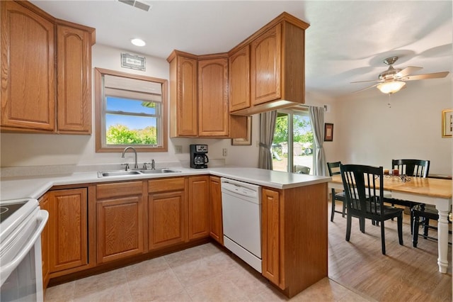 3028 Wachter Ave, Lower Burrell, PA 15068 - kitchen featuring dishwasher, a sink, a peninsula, range, and ceiling fan