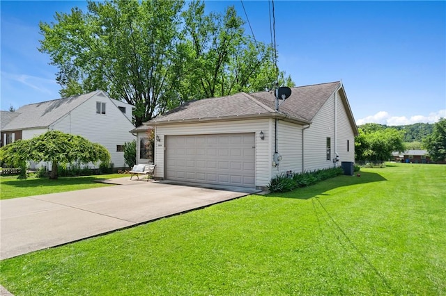 3028 Wachter Ave, Lower Burrell, PA 15068 - view of property exterior with an attached garage, central AC, driveway, and a yard