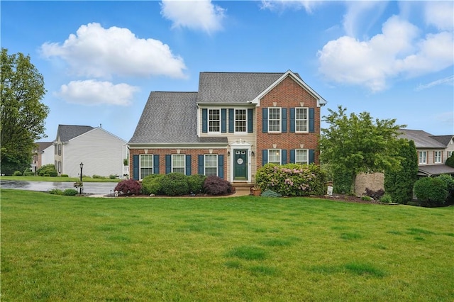 923 Arberdeen Dr, Hempfield Twp Wml, PA 15601 - view of front of home with brick siding and a front yard