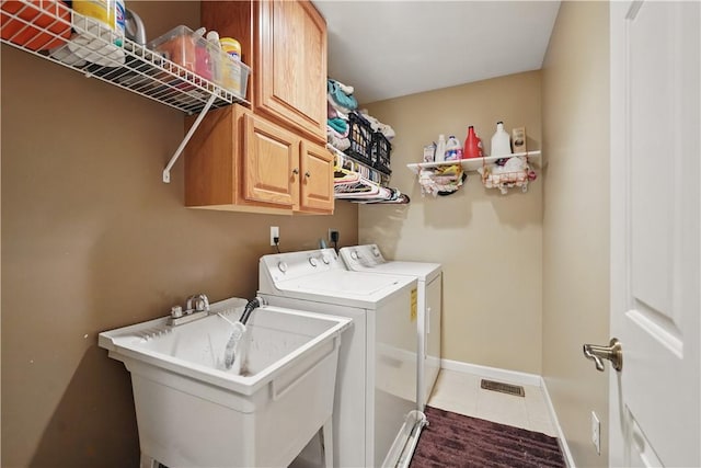 923 Arberdeen Dr, Hempfield Twp Wml, PA 15601 - laundry area featuring washer and clothes dryer, cabinet space, tile patterned floors, and baseboards