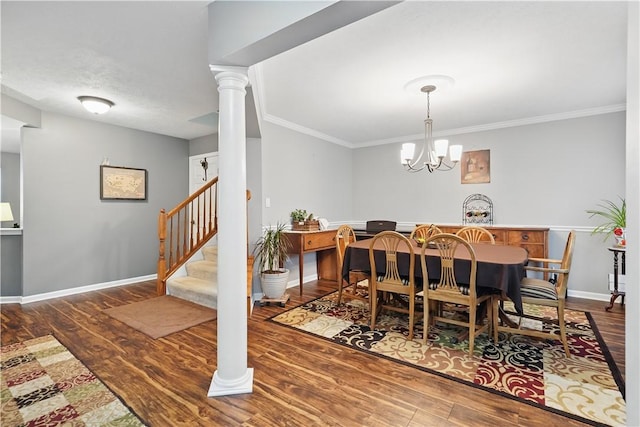 923 Arberdeen Dr, Hempfield Twp Wml, PA 15601 - dining room with wood finished floors, stairs, a chandelier, baseboards, and crown molding