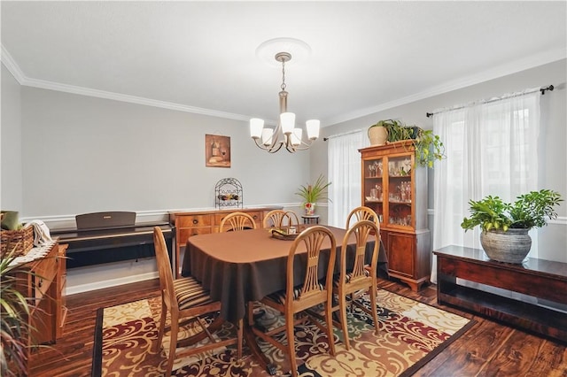 923 Arberdeen Dr, Hempfield Twp Wml, PA 15601 - dining area featuring a chandelier, ornamental molding, wood finished floors, and healthy amount of natural light