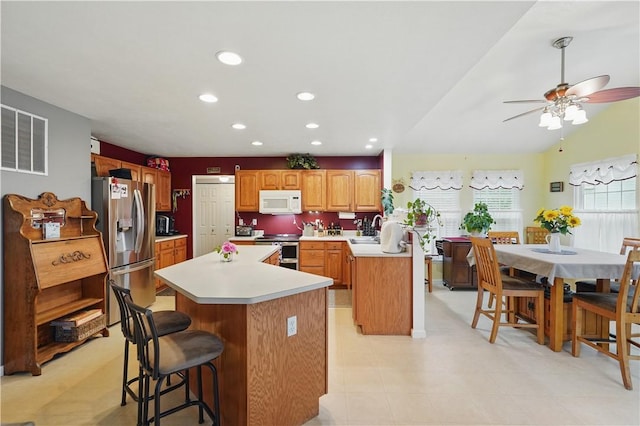 923 Arberdeen Dr, Hempfield Twp Wml, PA 15601 - kitchen featuring stainless steel appliances, light countertops, a kitchen island, a sink, and recessed lighting