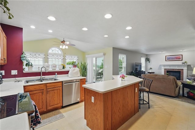 923 Arberdeen Dr, Hempfield Twp Wml, PA 15601 - kitchen with stainless steel dishwasher, a brick fireplace, a sink, light countertops, and a ceiling fan
