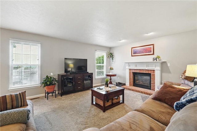 923 Arberdeen Dr, Hempfield Twp Wml, PA 15601 - living area featuring a brick fireplace, baseboards, and light colored carpet